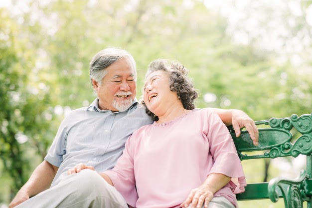happy asian senior couple laughing